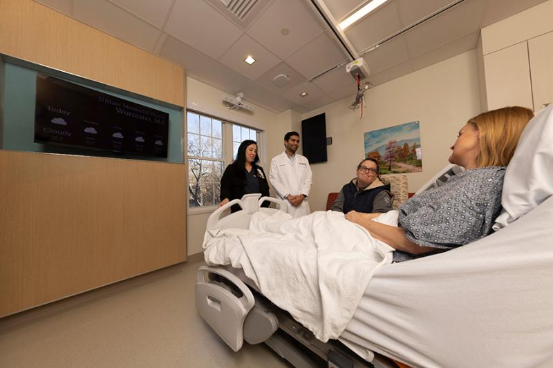 A patient's family and doctor visit the patient at the North Pavilion.