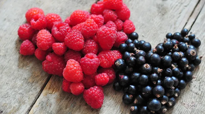 raspberries and blueberries shaped in hearts